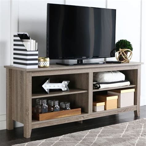 The driftwood gray finish, brushed nickel hardware, and tempered glass on this large 65 inch TV stand for sale at RC Willey will never leave you lacking for space. . Rc willey tv stand